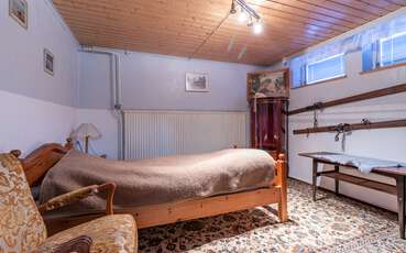 Schlafzimmer mit Einzelbett Ferienhaus Quade